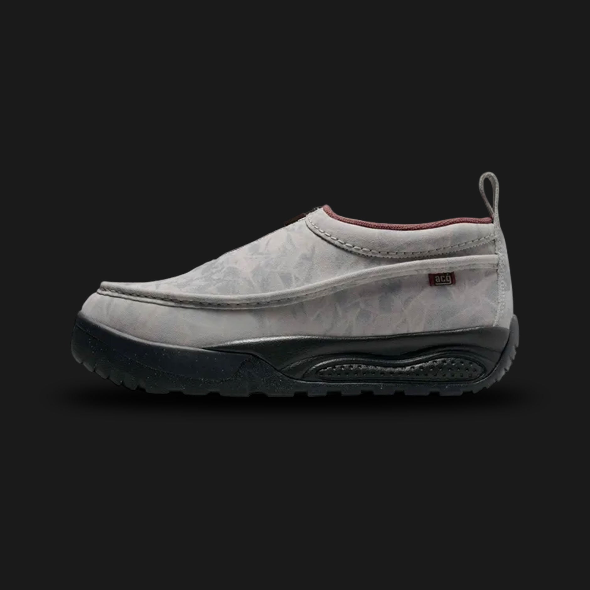 Nike ACG Izy moccasin-style shoes in Light Orewood Brown, Khaki, and Red Sepia (Design Code: HV4088-100). Featuring a premium suede upper with a zippered shroud closure for a sleek, laceless look and weather protection. Built on a rugged black rubber outsole with aggressive traction for outdoor versatility. Luxuntique offers 100% authentic Nike ACG footwear at the lowest price in Sri Lanka.