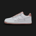 Nike Air Force 1 '07 Mini Jewel in White, Metallic Silver, and Particle Pink (IB6543-100). Features a premium white leather upper with a raised Metallic Silver mini jewel Swoosh and soft Particle Pink accents on the heel tab and tongue. Iconic chunky AF1 midsole. Luxuntique offers 100% authentic Nike footwear in Sri Lanka.