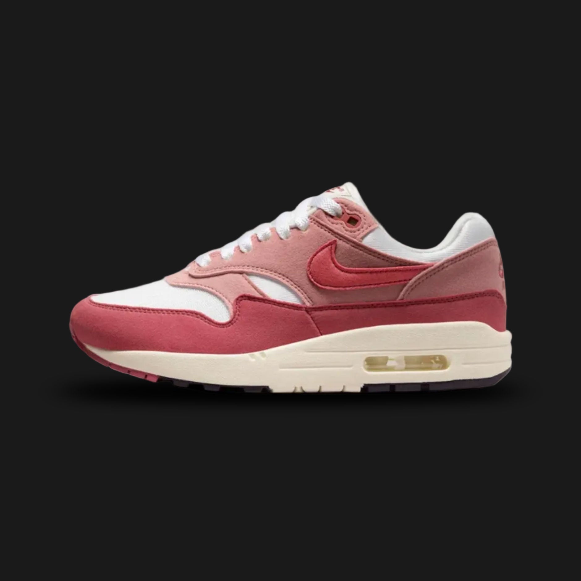 Nike Air Max 1 sneakers in Sail, Red Stardust, Coconut Milk, and Cedar (DZ2628-103). Features a dusty rose Red Stardust suede mudguard and Swoosh over a Sail mesh base. Elevated by a vintage Coconut Milk midsole and dark Cedar accents. Visible Air cushioning in the heel. Luxuntique offers 100% authentic Nike footwear in Sri Lanka.