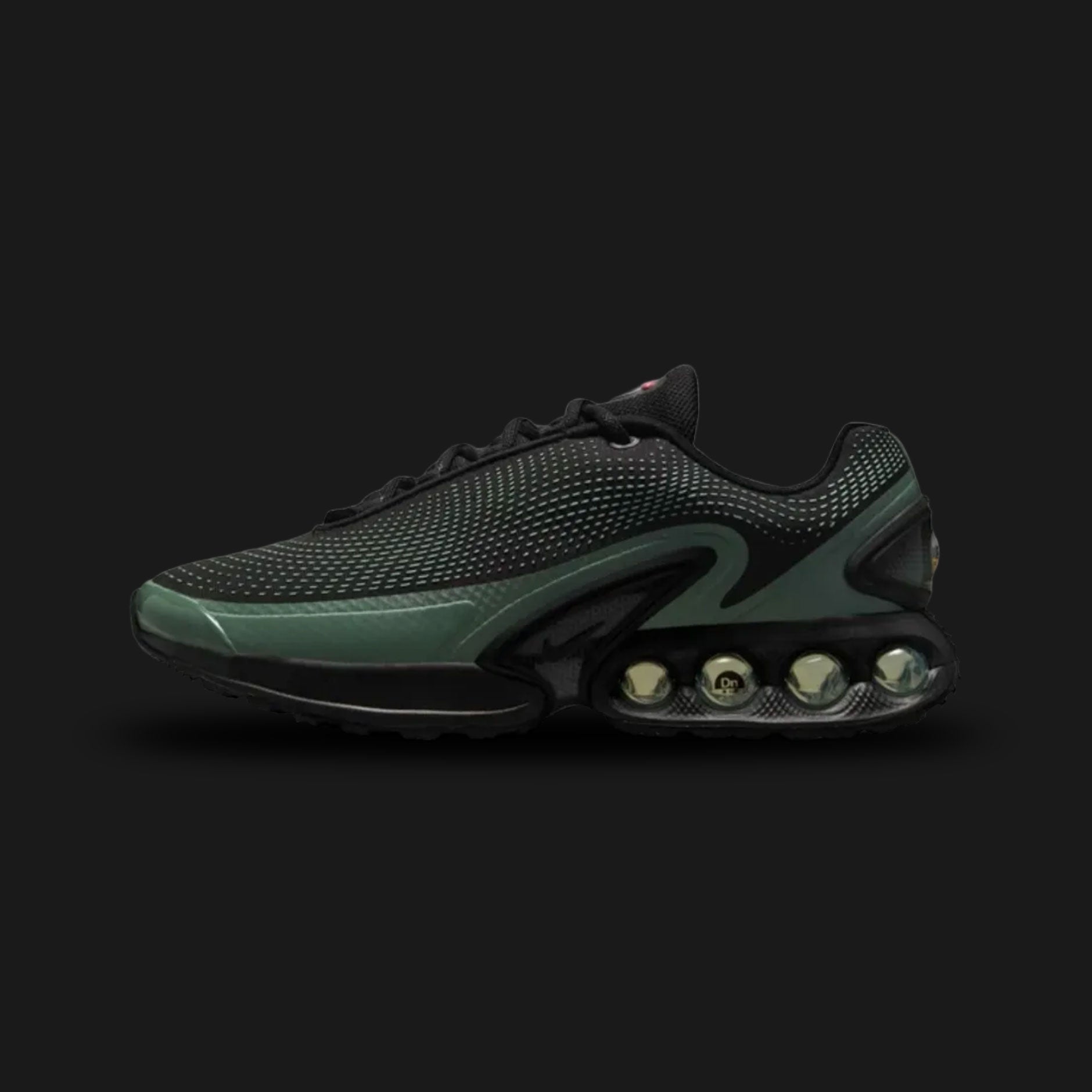 Nike Air Max Dn shoes in Black, Clay Green, and Cannon (Design Code: DV3337-023). Featuring a seamless black mesh upper with a futuristic textured haptic print and sleek synthetic overlays. Accented with tactical Clay Green and Cannon details, and supported by the revolutionary Dynamic Air unit system featuring dual-pressure tubes in the heel for unmatched bounce. Luxuntique offers 100% authentic Nike Air Max sneakers at the lowest price in Sri Lanka.