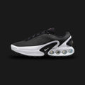 Nike Air Max Dn in Black, Cool Grey, and Pure Platinum (FJ3145-002). Features a Black haptic textured upper and the revolutionary Dynamic Air four-tube system in the heel. Accented by Metallic Silver midfoot shanks. Luxuntique offers 100% authentic Nike footwear in Sri Lanka.