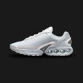Nike Air Max Dn in White, Pure Platinum, and Metallic Silver (FJ3145-100). Features a multi-layered haptic textured upper and the revolutionary Dynamic Air dual-pressure four-tube system in the heel. Accented by Metallic Silver midfoot shanks. Luxuntique offers 100% authentic Nike footwear in Sri Lanka.