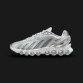 Nike Air Max Dn8 in Wolf Grey, Off-White, and Metallic Silver (HF5509-001). Features a multi-layered haptic textured upper in Wolf Grey with striking Metallic Silver accents. Showcases the revolutionary eight-chamber Dynamic Air cushioning system in the heel. Luxuntique offers 100% authentic Nike footwear in Sri Lanka.