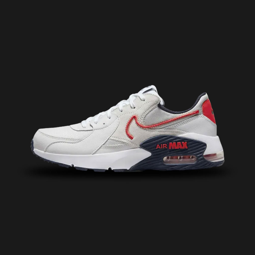 Nike Air Max Excee men's shoes in Photon Dust, Dark Obsidian, and Track Red (Design Code: DZ0795-013). Featuring a visible Max Air unit through three windows—inspired by the Air Max 90—with an elongated design for a modern look. Built with a mesh, leather, and suede upper for breathable durability and a foam midsole for lightweight comfort. Luxuntique offers 100% authentic Nike sneakers at the lowest price in Sri Lanka.