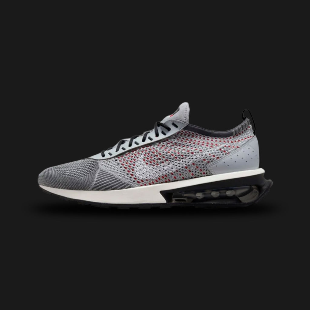 Nike Air Max Flyknit Racer lifestyle shoes in Wolf Grey, Black, Dark Grey, and White (Design Code: FD4610-001). Featuring a featherweight, form-fitting Flyknit upper seamlessly blending Wolf Grey and Black yarns for a dynamic gradient aesthetic. Accented with sleek black synthetic leather eyestays and a crisp White Swoosh. Supported by a modernized foam midsole featuring a cored-out, visible Air Max heel unit for supreme cushioning. Luxuntique offers 100% authentic Nike Air Max sneakers at the lowest price 