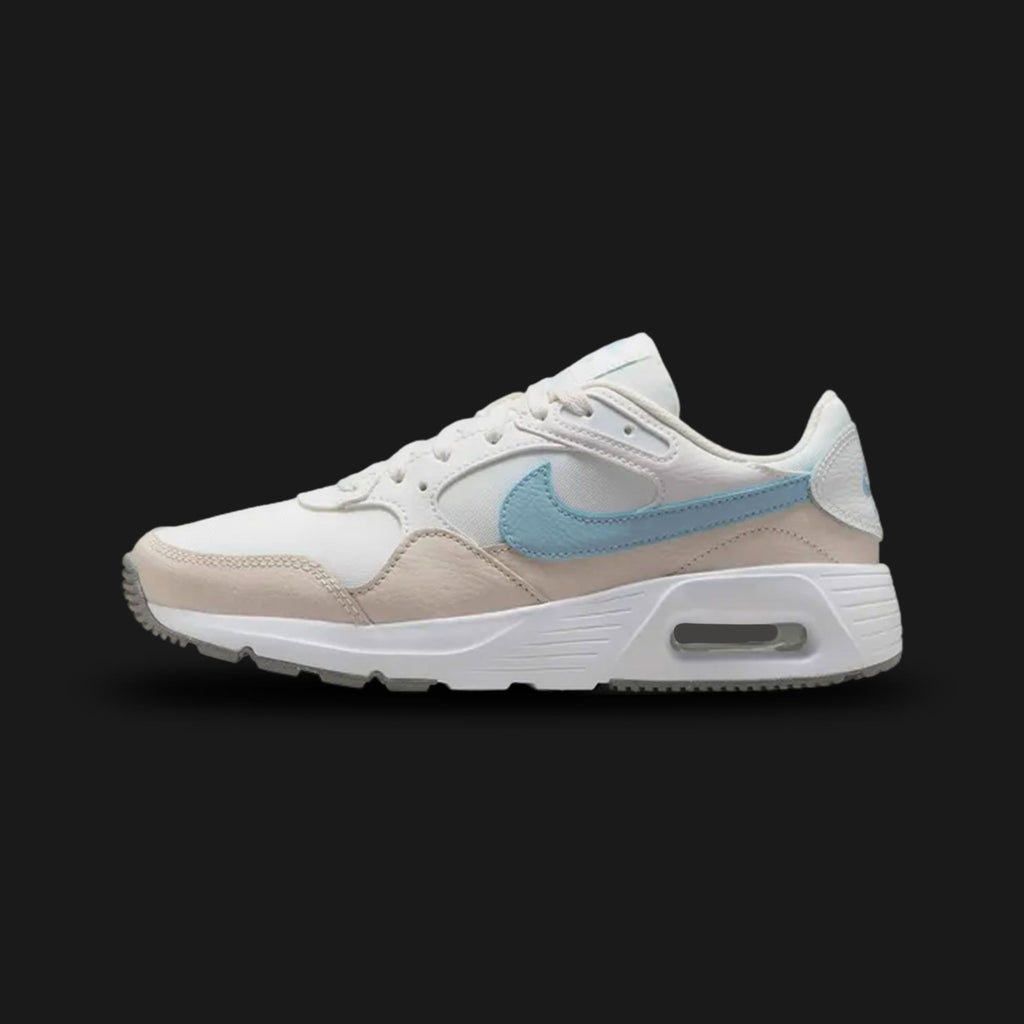 Nike Air Max SC women's shoes in Summit White, Light Orewood Brown, and Light Armoury Blue (Design Code: CW4554-126). Featuring a visible Max Air unit for responsive cushioning, a breathable mesh upper with leather and suede overlays, and a durable rubber outsole with flex grooves. Luxuntique offers 100% authentic Nike Air Max sneakers for women at the lowest price in Sri Lanka.