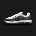 Nike Air Max TL 2.5 shoes in White, Black, Smoke Grey, and Wild Grape (Design Code: FZ4110-105). Featuring a layered White mesh upper with wavy Black and Smoke Grey synthetic overlays for a dynamic, retro-sport look. Accented with vibrant Wild Grape purple details on the Swoosh and tongue, supported by a full-length visible Total Air unit. Luxuntique offers 100% authentic Nike Air Max sneakers at the lowest price in Sri Lanka.