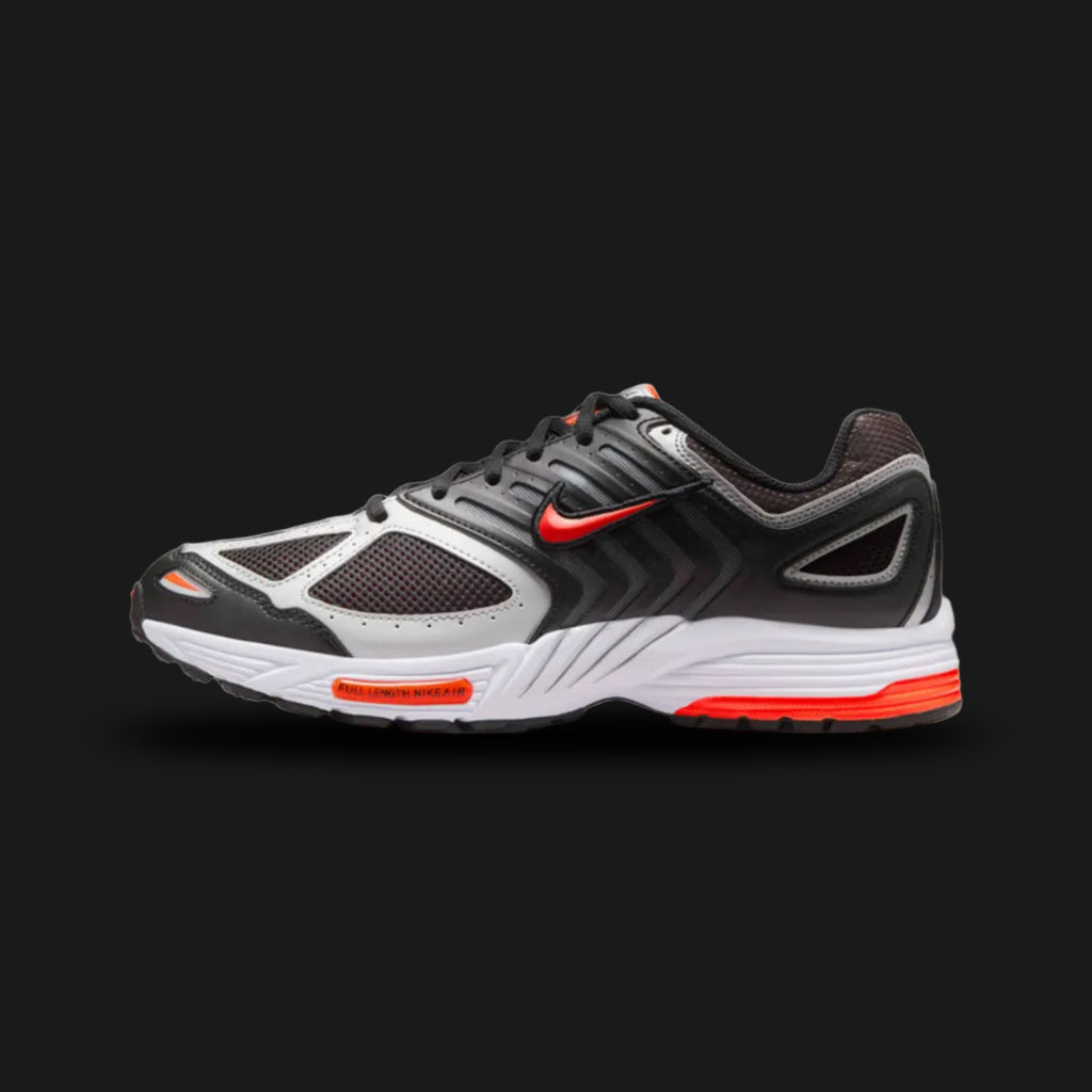 Nike Air Pegasus 2005 retro running shoes in Black, Metallic Silver, White, and Bright Crimson (Design Code: HQ3031-004). Featuring a layered black upper combining breathable textiles with real and synthetic leather for early-2000s durability. Accented by gleaming Metallic Silver overlays and striking Bright Crimson details. Supported by a white foam midsole with responsive Nike Air cushioning and a classic Waffle-inspired rubber outsole. Luxuntique offers 100% authentic Nike lifestyle sneakers at the lowes