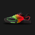 Nike Air Pegasus Wave SE lifestyle and running shoes in Black, Bright Crimson, and Green Strike (Design Code: IB2984-001). Featuring a breathable black mesh upper encased in futuristic, wavy synthetic TPU overlays for dynamic structural support. Accented with aggressive Bright Crimson red and neon Green Strike details, all resting on a sculpted black foam midsole equipped with responsive Air cushioning. Luxuntique offers 100% authentic Nike tech-runner sneakers at the lowest price in Sri Lanka.