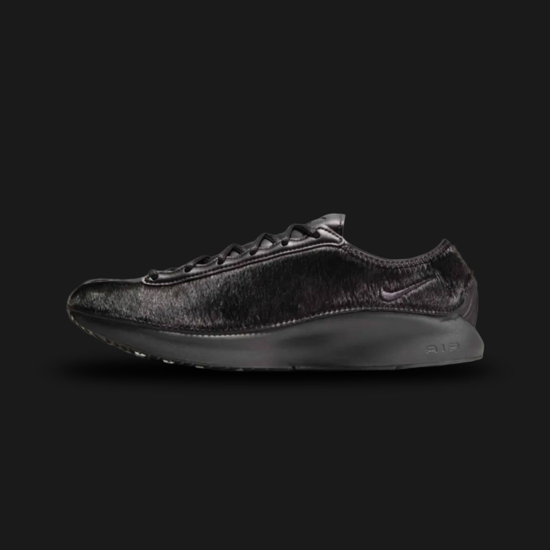 Nike Air Superfly LX in Black, Photon Dust, and Off-Noir (HQ9148-001). Features a premium black pony hair upper with light Photon Dust leather overlays and dark Off-Noir accents. Low-profile archival runner with a signature angular heel and encapsulated Air cushioning.