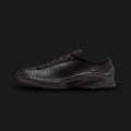 Nike Air Superfly in Black/Black/Black (HJ8082-002). Features a sleek, all-black perforated leather upper for breathability and tonal suede overlays. This low-profile archival runner includes encapsulated Air cushioning and a signature angular, aerodynamic heel design for a Y2K tech-wear aesthetic.