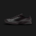Nike Air Superfly in Black/Black/Black (HJ8082-002). Features a sleek, all-black perforated leather upper for breathability and tonal suede overlays. This low-profile archival runner includes encapsulated Air cushioning and a signature angular, aerodynamic heel design for a Y2K tech-wear aesthetic.