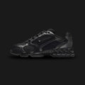 Nike Air Zoom Spiridon Cage 2 shoes in Black, Anthracite, and Smoke Grey (Design Code: HM8497-010). Featuring a breathable open-hole mesh upper encased in a glossy, supportive cage overlay for a futuristic tech aesthetic. Equipped with a visible phylite midsole and a Zoom Air unit in the heel for responsive, lightweight cushioning. Luxuntique offers 100% authentic Nike Y2K lifestyle runners at the lowest price in Sri Lanka.