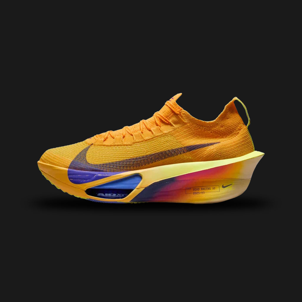 Nike Alphafly 3 marathon racing shoes in Laser Orange, Citron Pulse, Volt Ice, and Indigo Burst (FD8311-800). Features a hyper-lightweight, breathable AtomKnit 3.0 upper in vibrant orange and yellow hues. Includes a continuous ZoomX foam midsole, a full-length carbon fiber Flyplate, and dual visible Zoom Air pods in the forefoot accented by Indigo Burst. Luxuntique offers 100% authentic Nike in Sri Lanka.