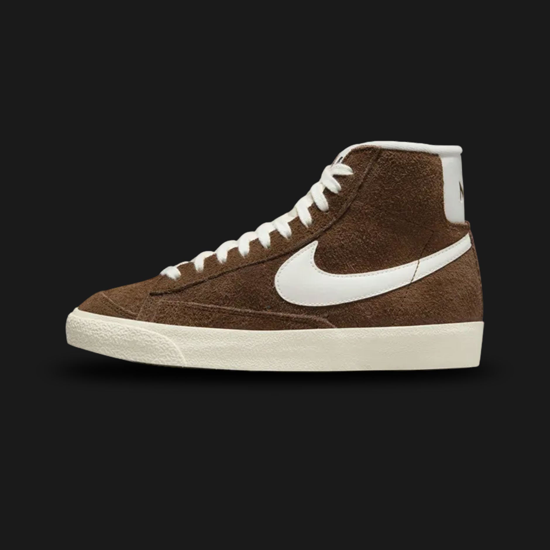 Nike Blazer Mid '77 Vintage women's shoes in Cacao Wow, Coconut Milk, and Sail (Design Code: DV7006-200). Featuring a rich Cacao Wow chocolate brown suede upper with a contrast Coconut Milk leather Swoosh and Sail vintage-treated midsole. Includes the iconic exposed foam tongue and a durable vulcanized rubber outsole. Luxuntique offers 100% authentic Nike Blazer sneakers at the lowest price in Sri Lanka.