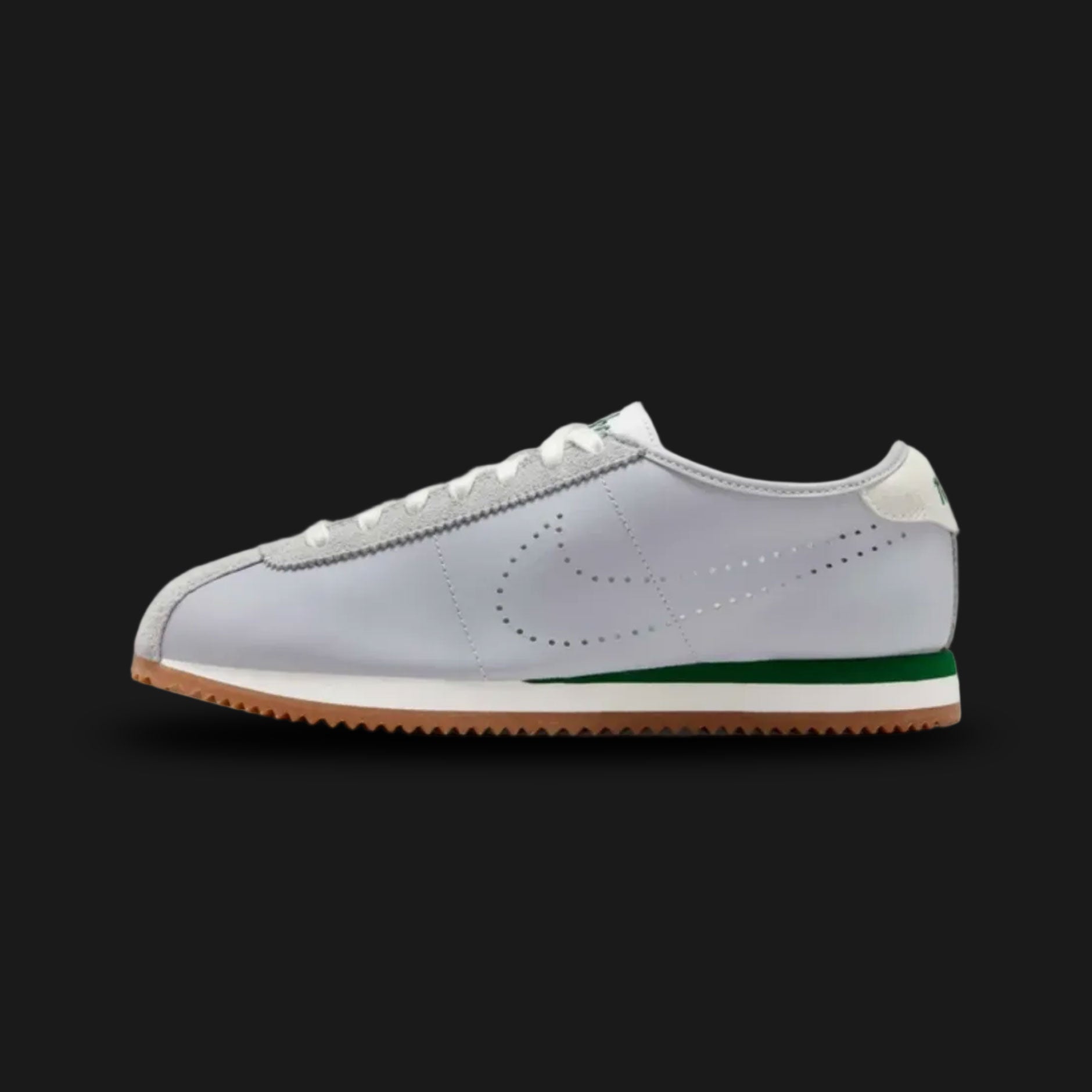 Nike Cortez Leather in Wolf Grey, Sport Green, and Gum (HQ1841-001). Features a premium Wolf Grey leather upper with vibrant Sport Green accents on the Swoosh and heel tab. Signature Summit White wedge midsole and a serrated Gum Medium Brown outsole. Luxuntique offers 100% authentic Nike footwear in Sri Lanka.