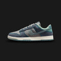 Nike Dunk Low Retro SE shoes in Pencil Point, Mineral Slate, and Dark Obsidian (IH1942-002). Features a premium mixed-material upper with a neutral Pencil Point base and muted Mineral Slate overlays. Includes a striking Dark Obsidian Swoosh, classic perforated toe box, and a durable rubber cupsole. Luxuntique guarantees 100% authentic Nike footwear in Sri Lanka.