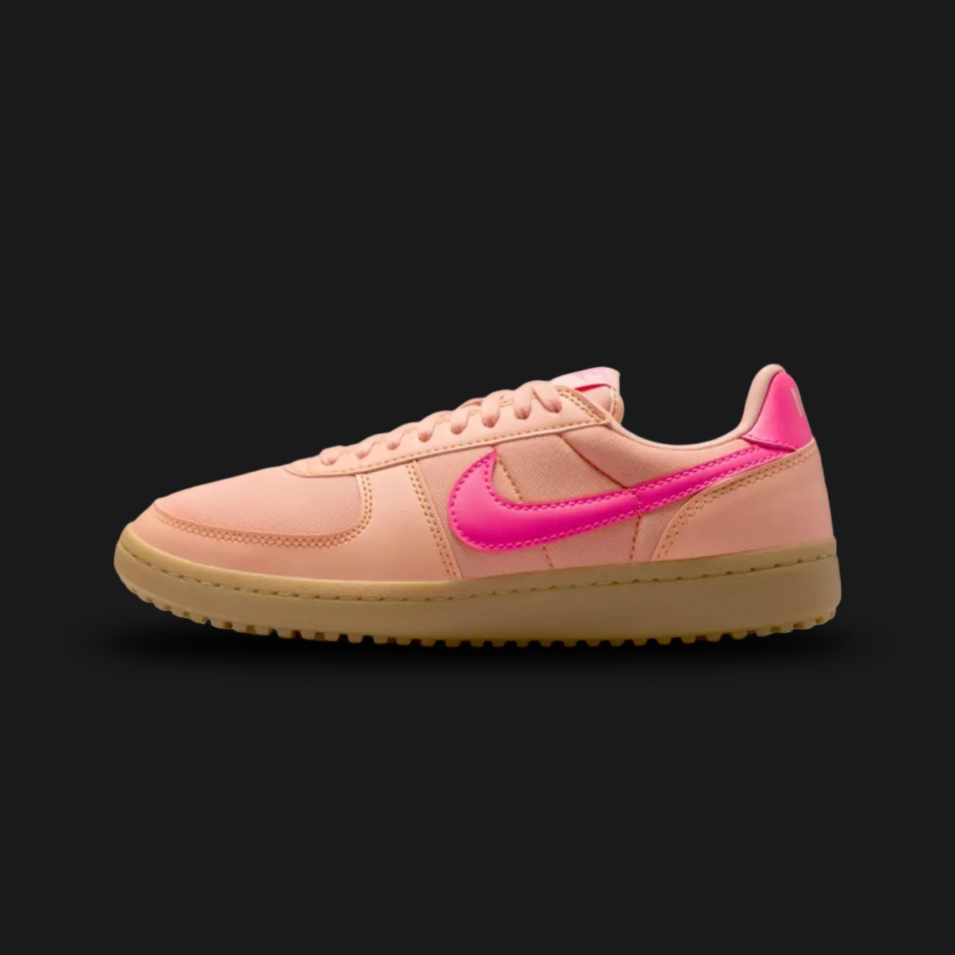 Nike Field General '82 vintage lifestyle shoes in Apricot Agate, Gum Light Brown, and Hyper Pink (Design Code: FZ5593-800). Featuring a breathable, warm Apricot Agate peachy-orange nylon upper reinforced with matching tonal suede overlays for a classic 1980s turf aesthetic. Accented by a vibrant, high-contrast Hyper Pink leather Nike Swoosh and heel tab. Securely built on a rugged, Gum Light Brown rubber waffle outsole originally designed for gridiron traction. Luxuntique offers 100% authentic Nike retro fo