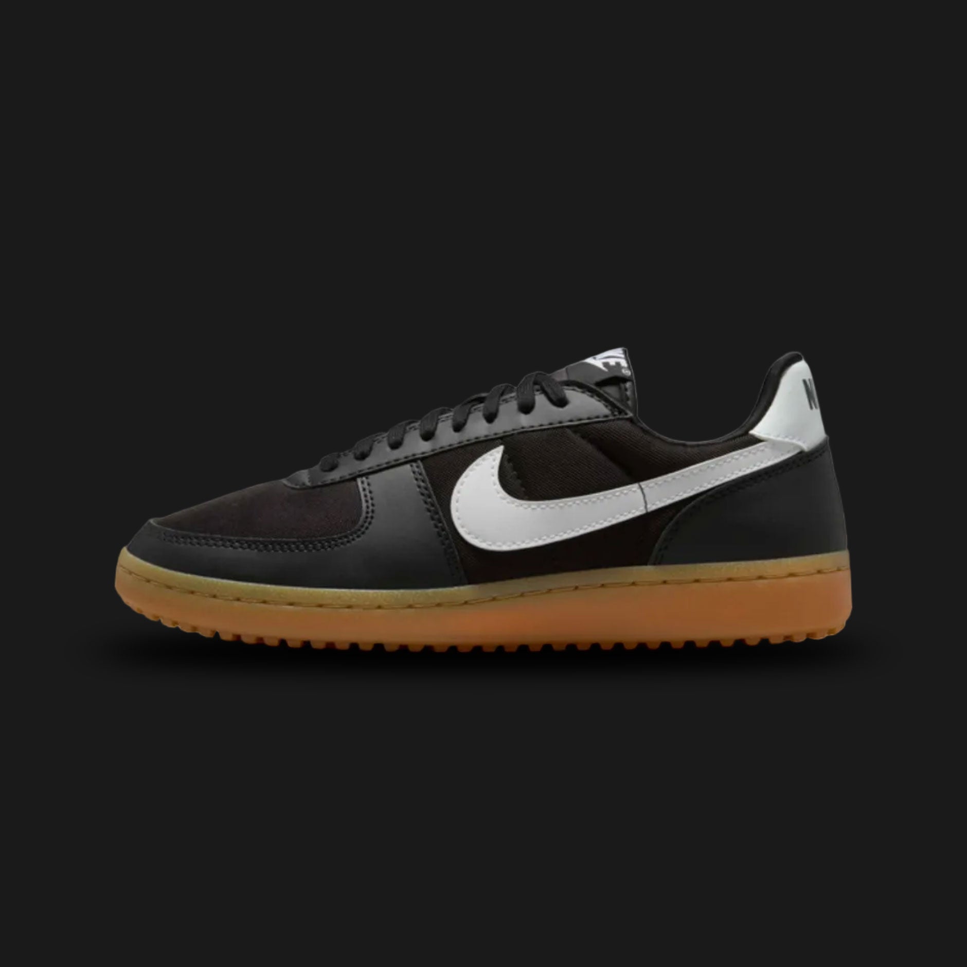Nike Field General '82 vintage lifestyle shoes in Black, Gum Light Brown, and White (Design Code: FZ5593-002). Featuring a durable, breathable Black nylon upper reinforced with matching tonal Black suede overlays for a classic 1980s turf aesthetic. Accented by a bold, high-contrast crisp White leather Nike Swoosh and heel tab. Securely built on a rugged, Gum Light Brown rubber waffle outsole originally designed for gridiron traction. Luxuntique offers 100% authentic Nike retro footwear at the lowest price i