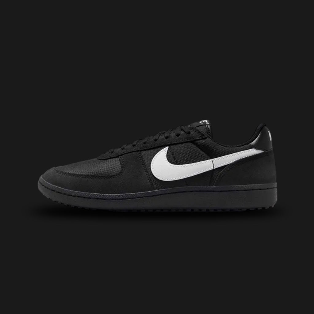 Nike Field General 82 retro shoes in Black and White (Design Code: HF3165-001). Featuring a durable black nylon base with premium black suede and leather overlays, contrasted sharply by a crisp white leather Swoosh and heel tab. Built on a signature black nubby Waffle outsole with gridiron-inspired traction for everyday streetwear durability. Luxuntique offers 100% authentic Nike lifestyle sneakers at the lowest price in Sri Lanka.