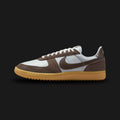 Nike Field General 82 retro shoes in Pure Platinum, Ironstone, and Gum Yellow (Design Code: HF3165-003). Featuring a clean Pure Platinum woven nylon base layered with tonal suede overlays, contrasted by a sharp brownish-grey Ironstone leather Swoosh. Built on the signature vintage nubby Waffle outsole in Gum Yellow for superior grip and heritage style. Luxuntique offers 100% authentic Nike lifestyle sneakers at the lowest price in Sri Lanka.
