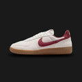 Nike Field General Suede vintage lifestyle shoes in Light Bone, Gum Dark Brown, and Dark Team Red (Design Code: IF1743-001). Featuring a premium, richly textured Light Bone suede upper that offers a breathable, earthy take on the classic turf aesthetic. Accented by a bold, deep Dark Team Red leather Nike Swoosh and heel tab. Securely built on a rugged, Gum Dark Brown rubber waffle outsole originally designed for gridiron traction. Luxuntique offers 100% authentic Nike retro footwear at the lowest price in S