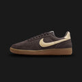 Nike Field General Suede vintage lifestyle shoes in Velvet Brown, Gum Dark Brown, and Alabaster (Design Code: IF1743-202). Featuring a premium, richly textured Velvet Brown suede upper that offers a luxurious, earthy take on the classic turf aesthetic. Accented by a smooth, contrasting Alabaster off-white leather Nike Swoosh and heel tab. Securely built on a rugged, Gum Dark Brown rubber waffle outsole originally designed for gridiron traction. Luxuntique offers 100% authentic Nike retro footwear at the low