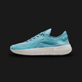 Nike Free 2025 running shoes in Denim Turquoise, Dusty Cactus, Platinum Tint, and Smoky Blue (HF1078-402). Features a highly flexible, breathable mesh upper in deep oceanic tones. Includes a minimalist Platinum Tint foam midsole engineered with deep laser-siped flex grooves for a natural barefoot feel, highlighted by Dusty Cactus accents. Luxuntique guarantees 100% authentic Nike footwear in Sri Lanka.
