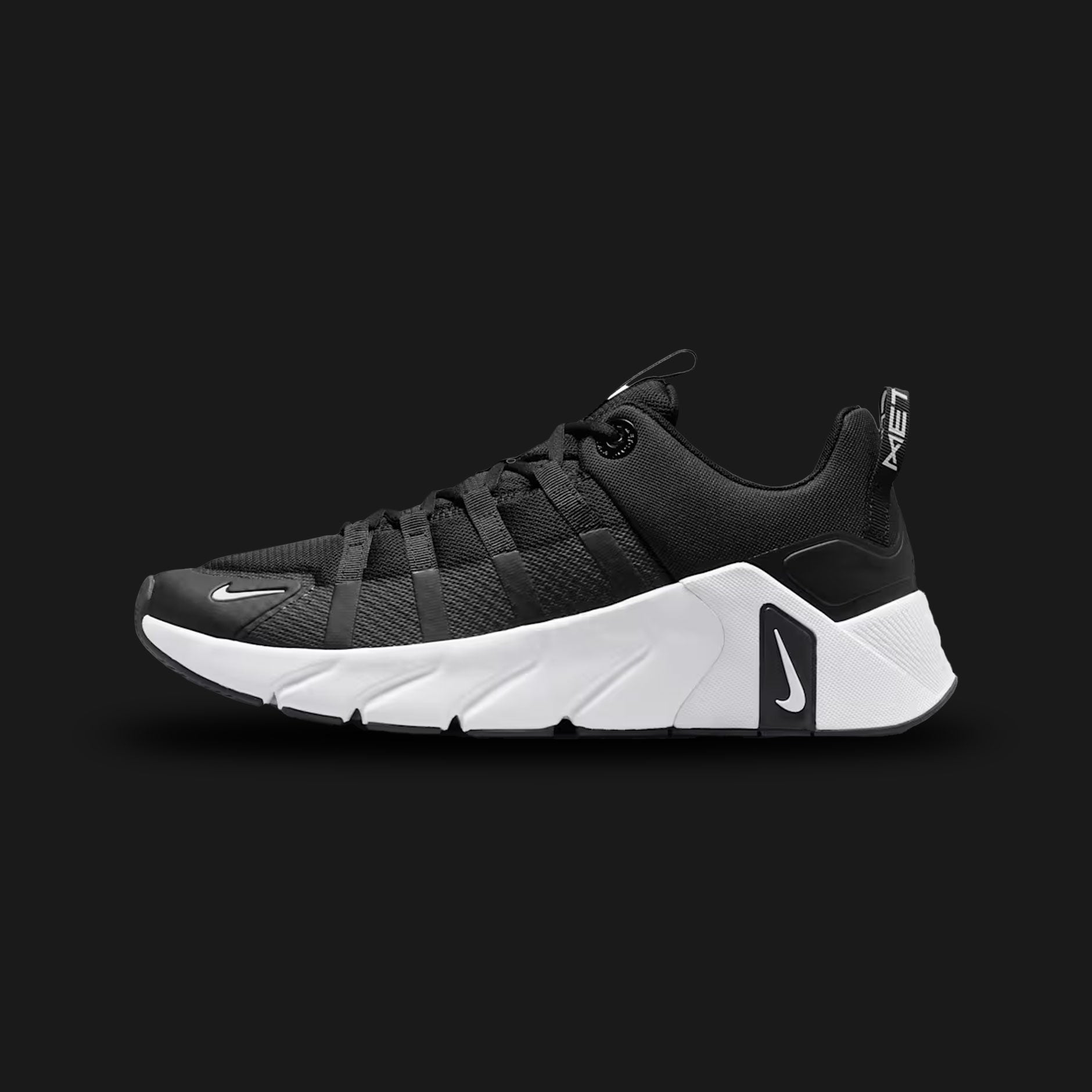 Nike Free Metcon 7 training shoes in Black, Photon Dust, Anthracite, and White (II7405-002). Features a breathable Black and Anthracite chain-link mesh upper with stark White and Photon Dust accents. Includes a wide, stable heel for heavy lifting and a grooved Nike Free forefoot for explosive agility. Luxuntique offers 100% authentic Nike in Sri Lanka.