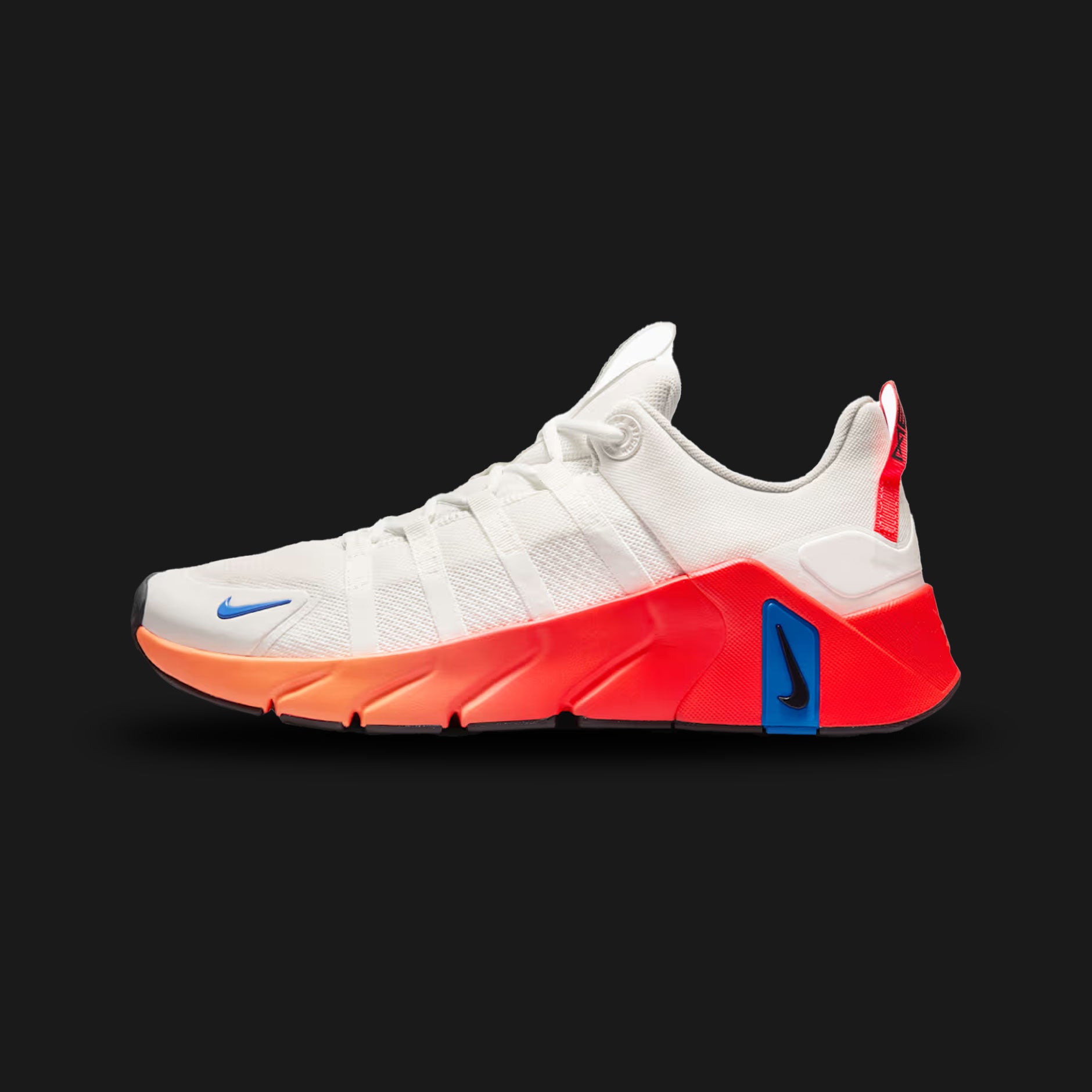 Nike Free Metcon 7 training shoes in Summit White, Bright Crimson, Orange Pulse, and Anthracite (II7405-102). Features a breathable Summit White chain-link mesh upper with vibrant Bright Crimson and Orange Pulse accents. Includes a wide, stable Anthracite heel for heavy lifting and a grooved Nike Free forefoot for explosive agility. Luxuntique offers 100% authentic Nike in Sri Lanka.
