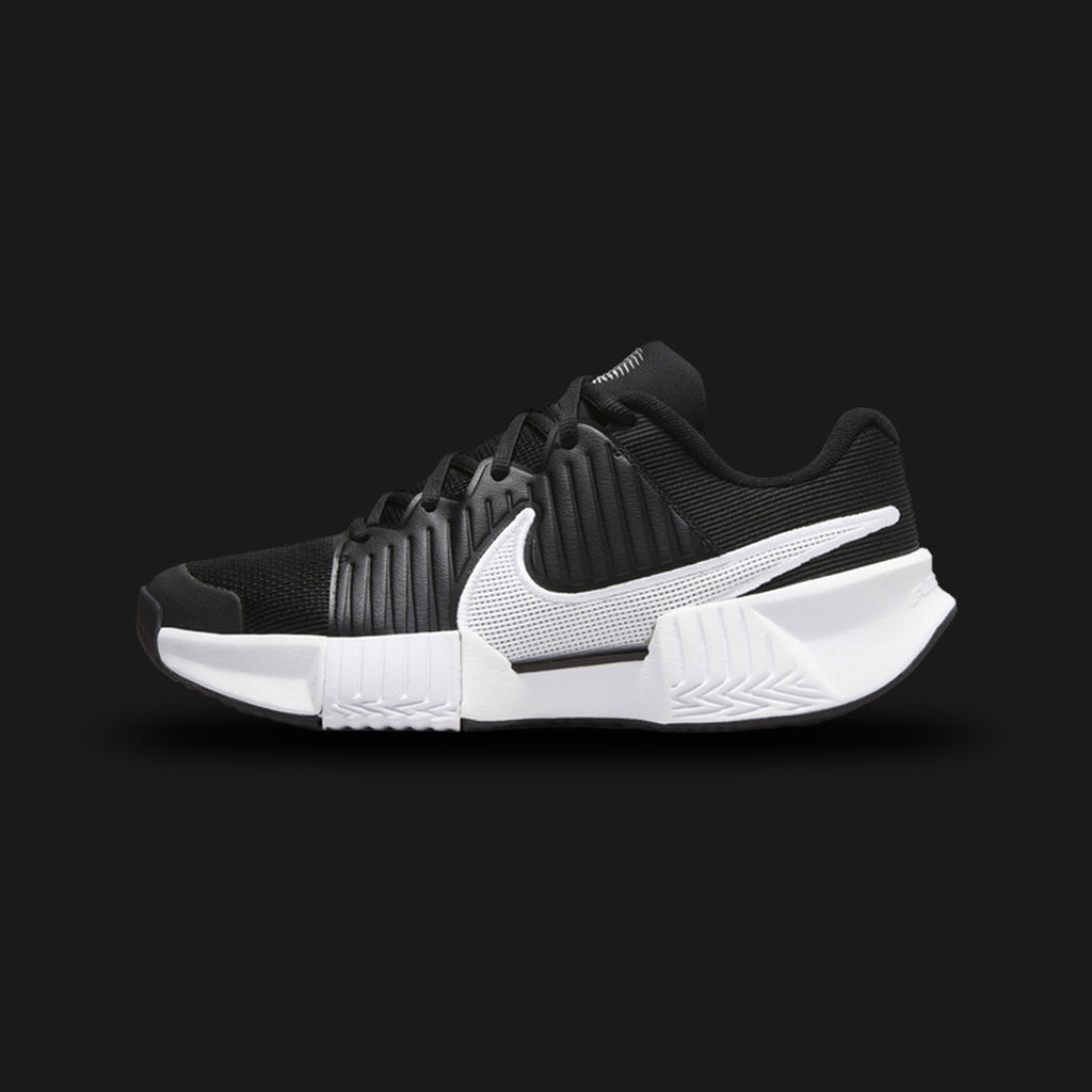Nike GP Challenge Pro shoes in Black and White (FJ1808-001). Features a breathable engineered mesh upper, synthetic midfoot stability overlays, a responsive Air Zoom heel cushioning unit, and a durable rubber outsole. Luxuntique guarantees 100% authentic footwear.