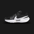 Nike GP Challenge Pro shoes in Black and White (FJ1808-001). Features a breathable engineered mesh upper, synthetic midfoot stability overlays, a responsive Air Zoom heel cushioning unit, and a durable rubber outsole. Luxuntique guarantees 100% authentic footwear.