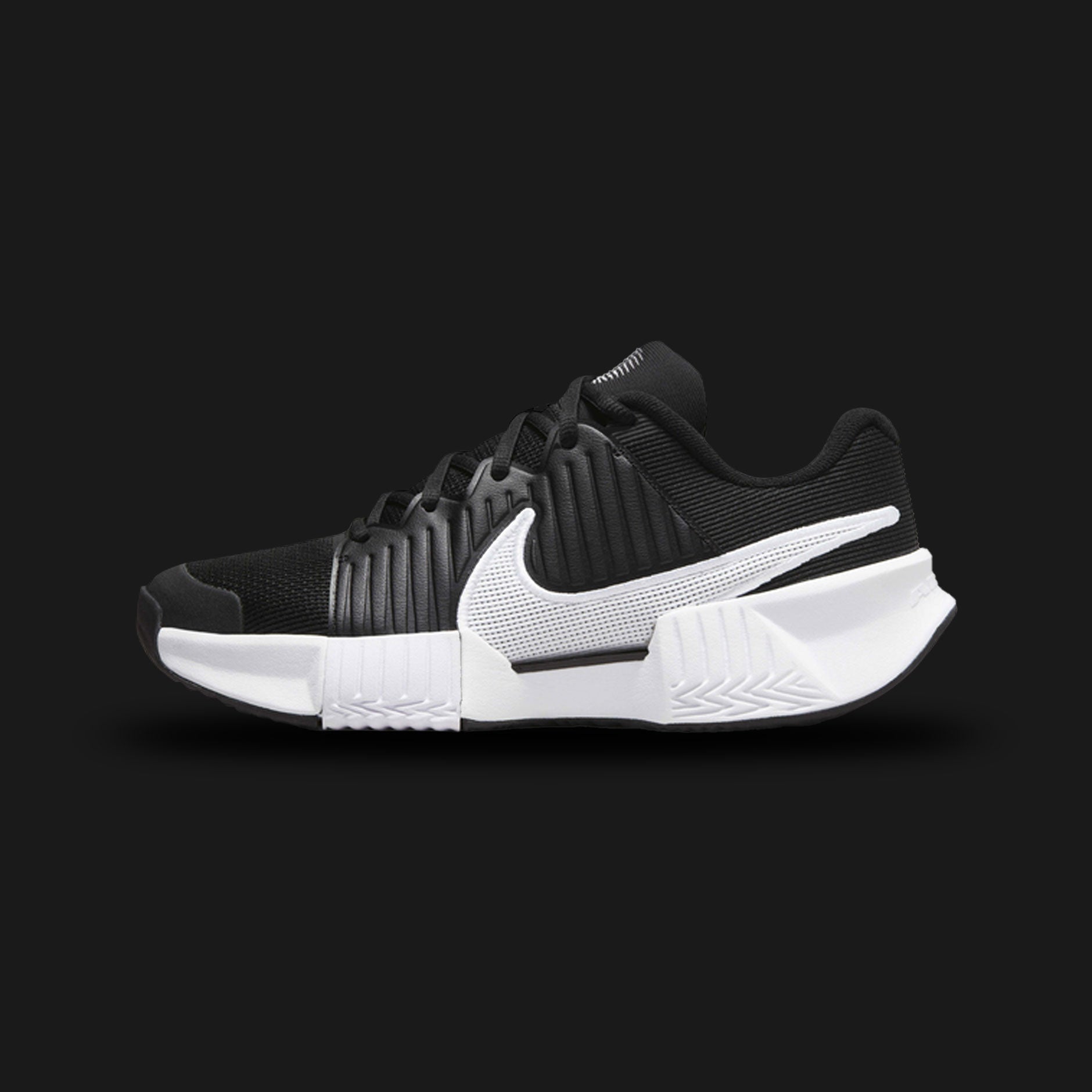 Nike GP Challenge Pro shoes in Black and White (FJ1808-001). Features a breathable engineered mesh upper, synthetic midfoot stability overlays, a responsive Air Zoom heel cushioning unit, and a durable rubber outsole. Luxuntique guarantees 100% authentic footwear.