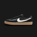 Nike Killshot 2 lifestyle sneakers in Black, Sail, and Gum Yellow (FZ5630-001). Featuring a premium Black leather upper with tonal suede overlays and a crisp Sail Nike Swoosh. Finished with a classic Gum Yellow rubber outsole. Luxuntique offers 100% authentic Nike footwear in Sri Lanka.