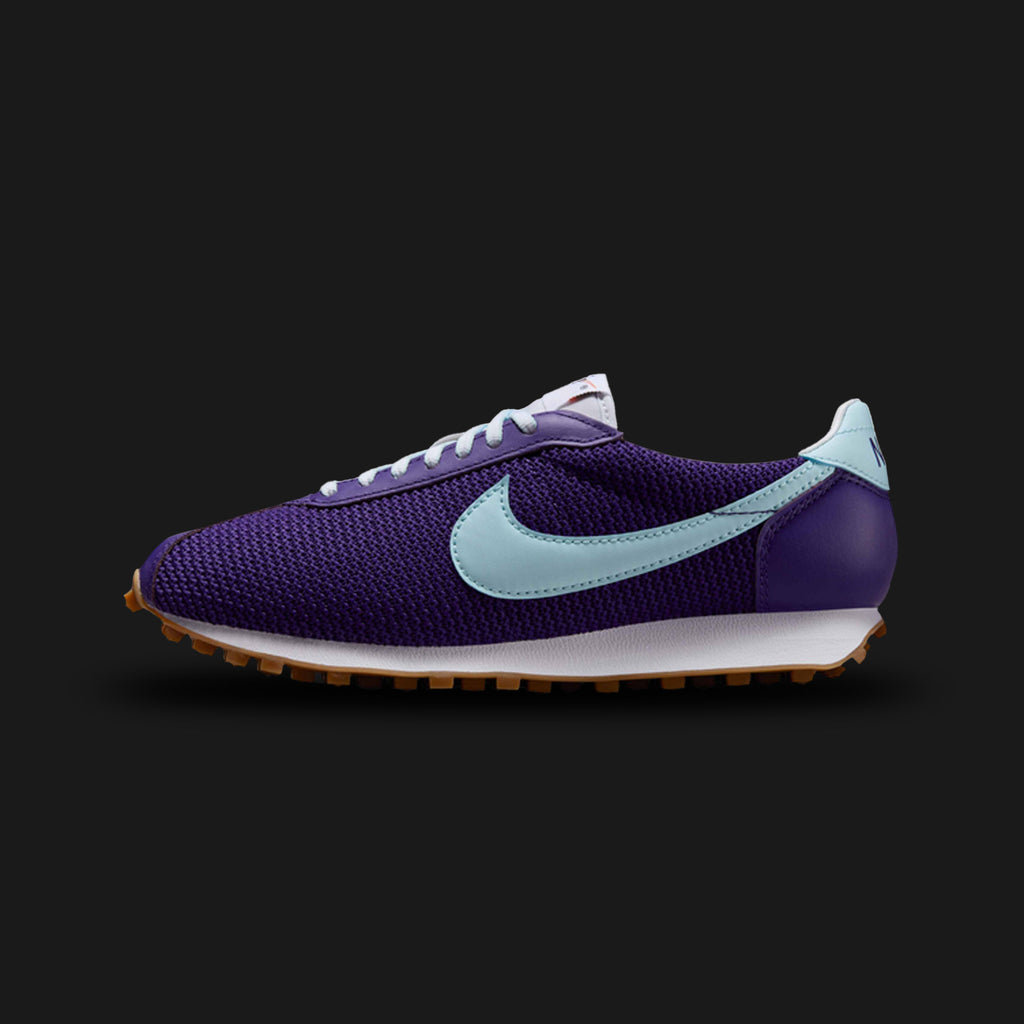 Nike LD-1000 SE shoes in Court Purple, Sail, Alabaster, and Glacier Blue (IH2128-500). Features a vintage mesh base with premium suede overlays, retro leather Swoosh, classic flared foam midsole, and an iconic waffle rubber outsole. Luxuntique guarantees 100% authentic footwear.