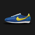 Nike LD-1000 SP vintage running shoes in Game Royal and Opti Yellow (FQ9079-400). Features a classic 1970s silhouette with a breathable Game Royal blue mesh upper and premium suede overlays. Includes a striking Opti Yellow Swoosh, a retro flared EVA foam midsole for stability, and the iconic black rubber Waffle outsole. Luxuntique offers 100% authentic Nike footwear in Sri Lanka.