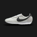 Nike LD-1000 retro running shoes in Summit White, White, and Black (Design Code: HF3227-100). Featuring a clean, vintage-inspired Summit White mesh upper seamlessly reinforced with tonal White suede and leather overlays. Accented by a bold Black Nike Swoosh and heel tab for sharp contrast. Anchored by a retro White foam midsole with a signature flared heel, all finished with a durable Black Waffle rubber outsole. Luxuntique offers 100% authentic Nike retro footwear at the lowest price in Sri Lanka.