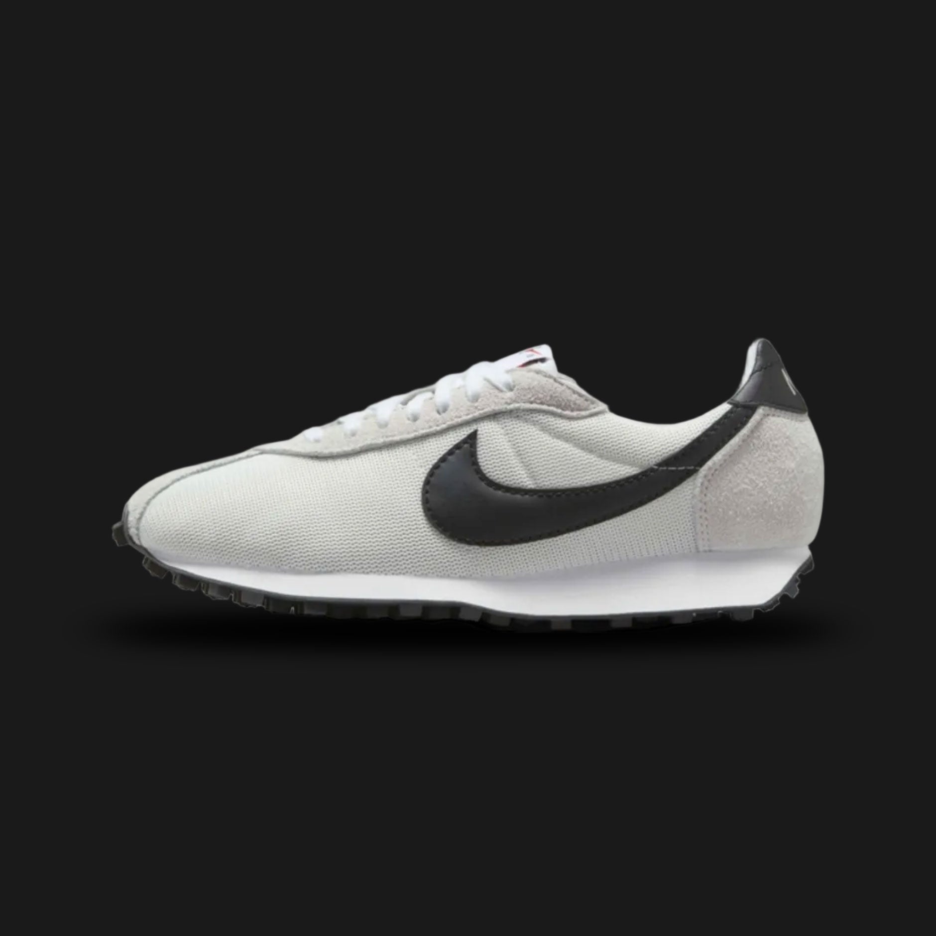 Nike LD-1000 retro running shoes in Summit White, White, and Black (Design Code: HF3227-100). Featuring a clean, vintage-inspired Summit White mesh upper seamlessly reinforced with tonal White suede and leather overlays. Accented by a bold Black Nike Swoosh and heel tab for sharp contrast. Anchored by a retro White foam midsole with a signature flared heel, all finished with a durable Black Waffle rubber outsole. Luxuntique offers 100% authentic Nike retro footwear at the lowest price in Sri Lanka.