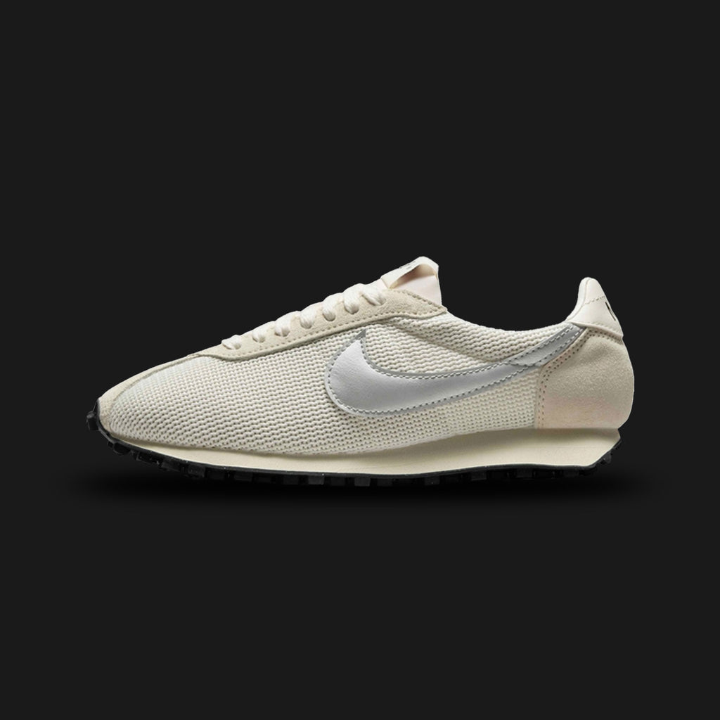 Nike LD-1000 vintage running shoes in Sail, Coconut Milk, Black, and Metallic Silver (IH4484-133). Features a classic 1970s silhouette with a breathable Sail mesh upper and creamy Coconut Milk suede overlays. Includes a striking Metallic Silver Swoosh, a retro flared foam midsole, and the iconic Black rubber Waffle outsole. Luxuntique offers 100% authentic Nike footwear in Sri Lanka.