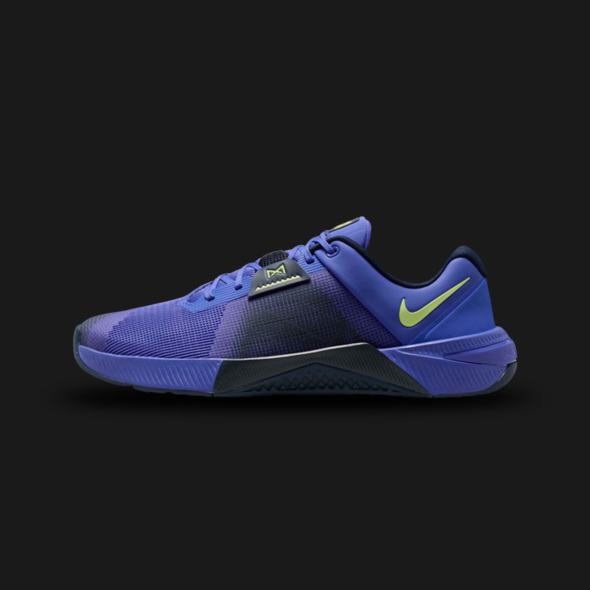Nike Metcon 10 shoes in Persian Violet, Obsidian, and Light Lemon Twist (HJ1875-501). Features a breathable mesh upper, wide stable heel with Hyperlift plate, dual-density foam midsole, and extended rubber tread for grip. Luxuntique guarantees 100% authentic footwear.