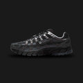 Nike P-6000 Suede shoes in Anthracite, Chrome, Metallic Silver, and Black (HF0015-002). Features a breathable mesh base with premium suede and metallic leather overlays, cushioned foam midsole, and a durable rubber outsole. Luxuntique guarantees 100% authentic footwear.