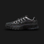 Nike P-6000 Suede shoes in Anthracite, Chrome, Metallic Silver, and Black (HF0015-002). Features a breathable mesh base with premium suede and metallic leather overlays, cushioned foam midsole, and a durable rubber outsole. Luxuntique guarantees 100% authentic footwear.