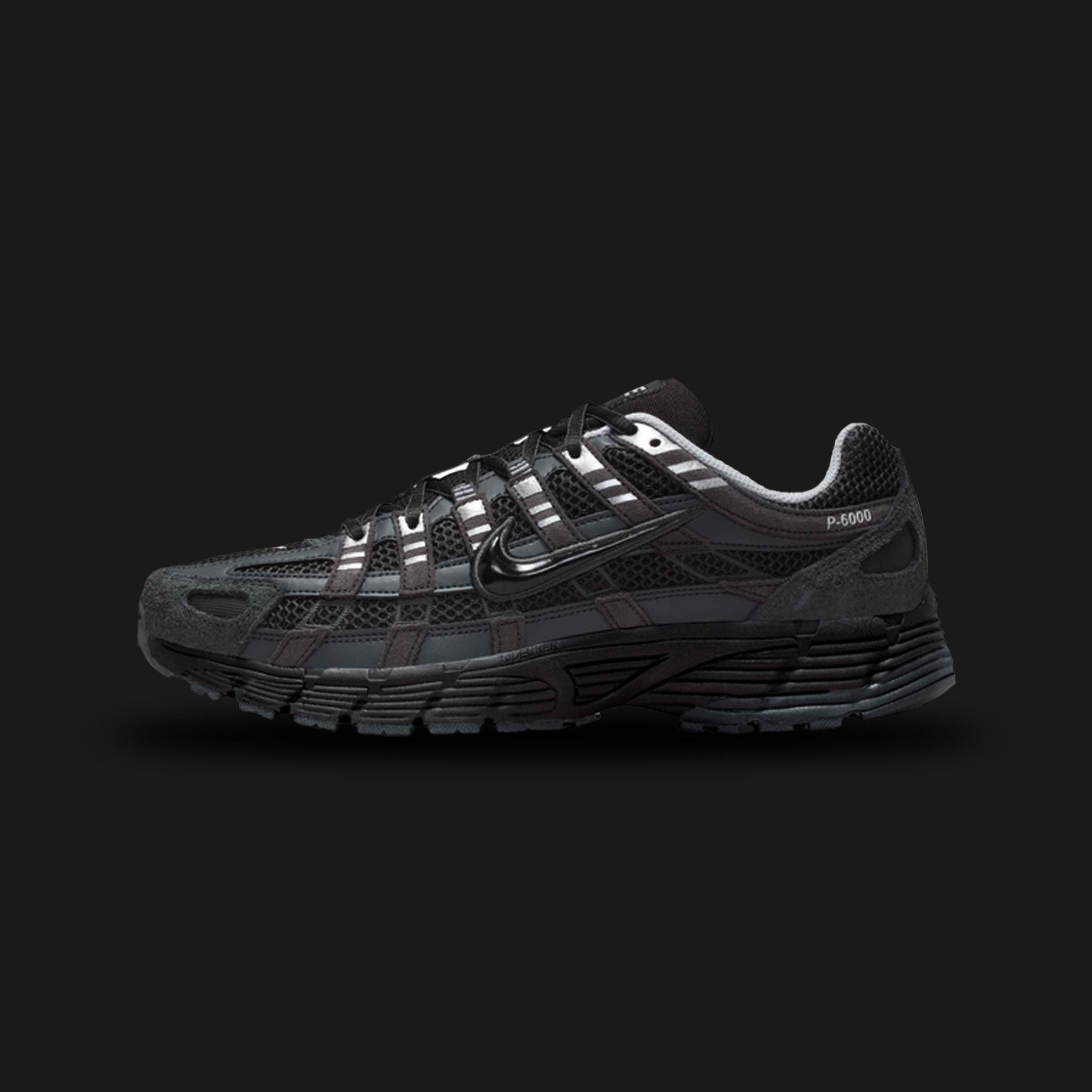 Nike P-6000 Suede shoes in Anthracite, Chrome, Metallic Silver, and Black (HF0015-002). Features a breathable mesh base with premium suede and metallic leather overlays, cushioned foam midsole, and a durable rubber outsole. Luxuntique guarantees 100% authentic footwear.