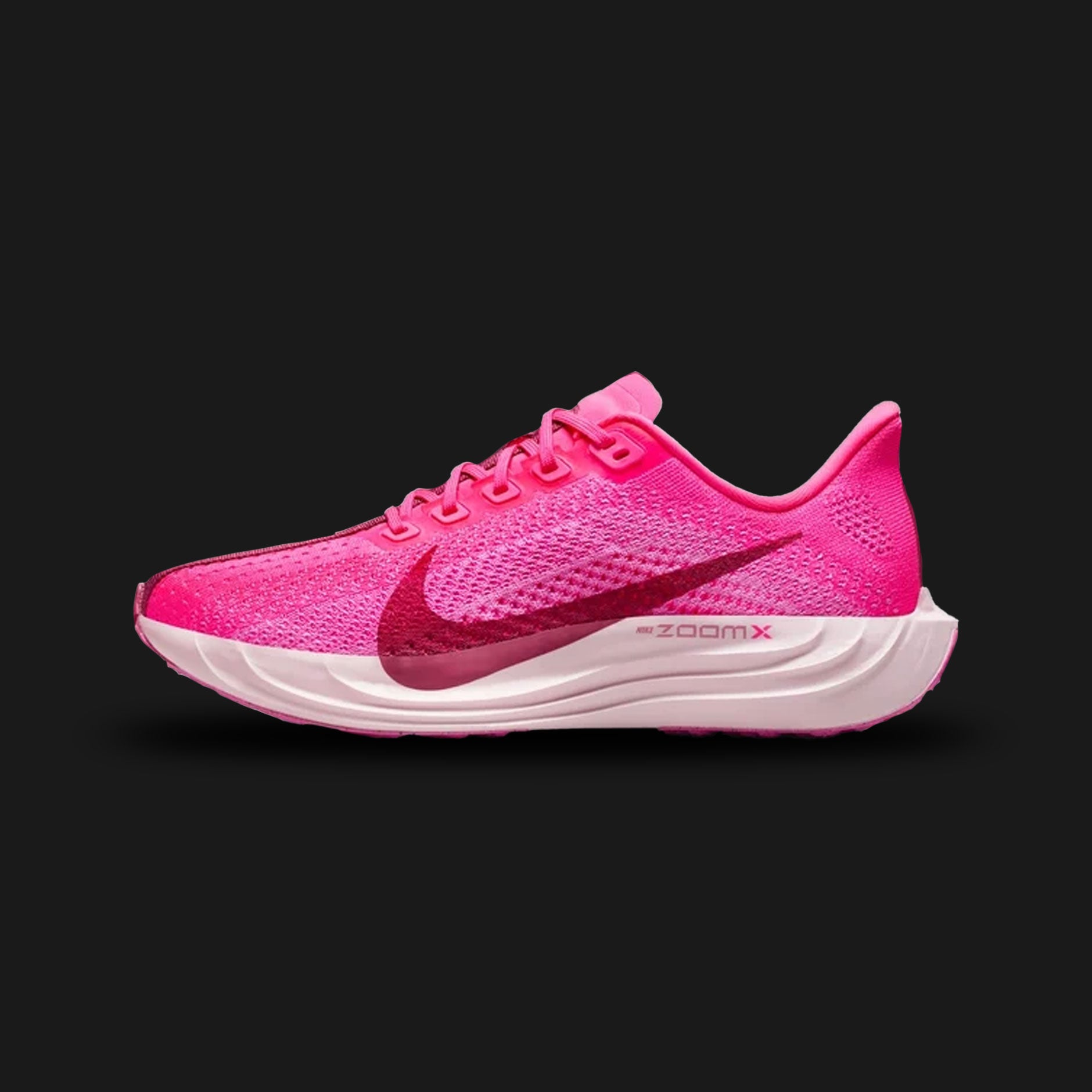 Nike Pegasus Plus unisex running shoes in vibrant Hyper Pink, Playful Pink, Pink Foam, and Sweet Beet (FQ7261-603). Features a lightweight, high-performance running silhouette crafted with a breathable full-length Flyknit upper for a secure, sock-like fit. Equipped with a premium full-length ZoomX foam midsole for explosive cushioning and energy return, a distinct central graphic stripe on the upper, and a durable rubber outsole for reliable multi-surface traction. Luxuntique guarantees 100% authentic Nike