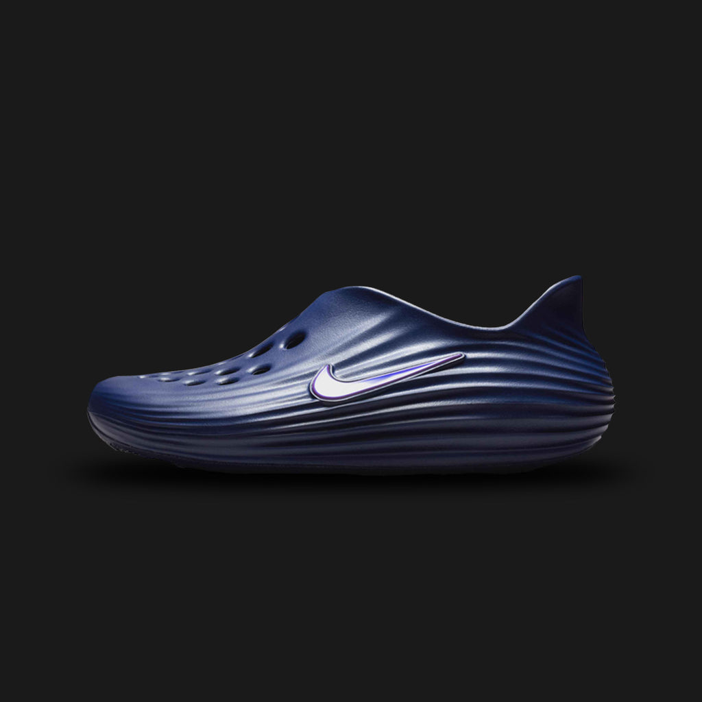 Nike ReactX Rejuven8 shoes in Blue Void and Indigo Burst (HV5060-403). Features a highly breathable Blue Void seamless inner bootie encased in a signature geometric TPU lattice cage for structural support. Includes a plush, high-energy return ReactX foam midsole in Indigo Burst and a durable rubber outsole. Luxuntique offers 100% authentic Nike in Sri Lanka.