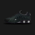 Nike Shox R4 in Black, Metallic Silver, and Seaweed (HQ7739-002). Synthetic upper with dark Seaweed panels, striking Metallic Silver overlays, and signature four-pillar Shox heel cushioning in Black. Luxuntique offers 100% authentic Nike footwear in Sri Lanka.