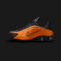 Nike Shox R4 shoes in Bright Ceramic, Black, and Metallic Dark Grey (Design Code: HQ1988-800). Featuring a seamless synthetic upper in vibrant Bright Ceramic orange with metallic silver detailing and perforated sides. Supported by the iconic 4-column Nike Shox cushioning system in the heel for responsive impact protection and a bold 2000s aesthetic. Luxuntique offers 100% authentic Nike Shox sneakers at the lowest price in Sri Lanka.