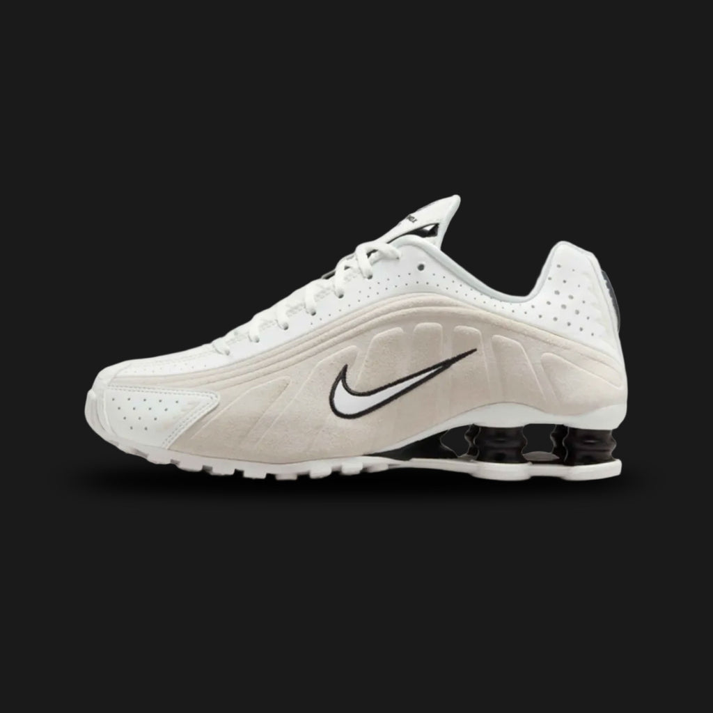 Nike Shox R4 sneakers in Summit White, Light Orewood Brown, and Black (HQ7739-100). Features a premium Summit White synthetic upper with earthy Light Orewood Brown overlays and signature four-pillar Shox heel cushioning in Black. Luxuntique offers 100% authentic Nike footwear in Sri Lanka.