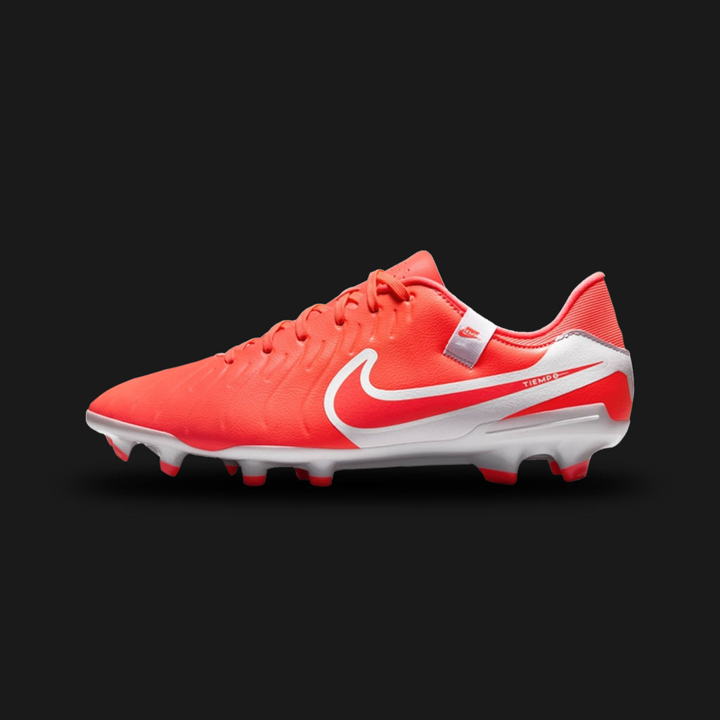 Nike Tiempo Legend 10 Academy MG football boots in vibrant Hot Lava and White (DV4337-800). Features a newly engineered FlyTouch Lite synthetic leather upper with micro-dot texturing for enhanced ball control. Includes a crisp White Swoosh, comfortable padded collar, and a versatile multi-ground (MG) soleplate with conical studs for traction on real and artificial grass. Luxuntique offers 100% authentic Nike footwear in Sri Lanka.