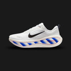 Nike Vomero Plus shoes in White, Racer Blue, Bright Crimson, and Black (II5257-100). Features a heavily layered breathable white mesh upper with synthetic overlays and a structural midfoot cage. Includes a plush Cushlon foam midsole with Zoom Air cushioning, accented by bold Racer Blue and Bright Crimson details. Luxuntique offers 100% authentic Nike in Sri Lanka.